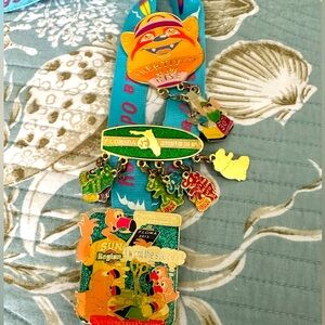 Florida Odysset pin lanyard and 4 collector pins